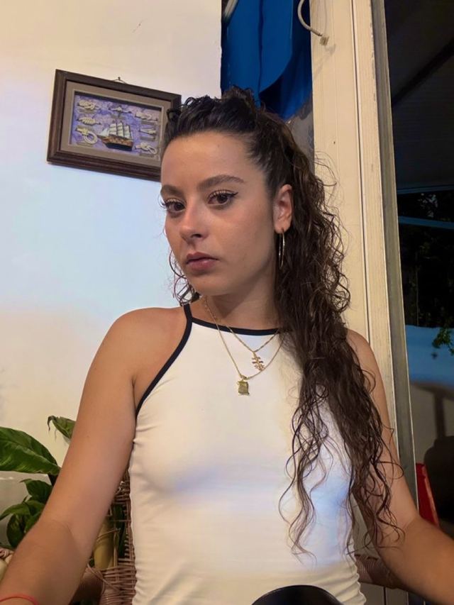 Martina in a white top