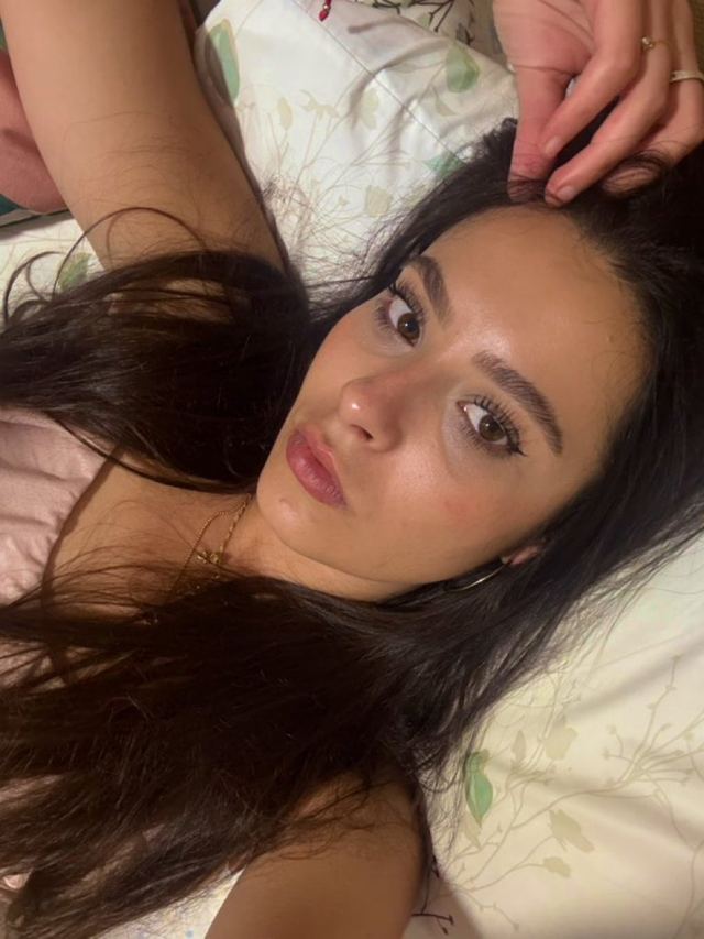 Martina lying down, looking at the camera